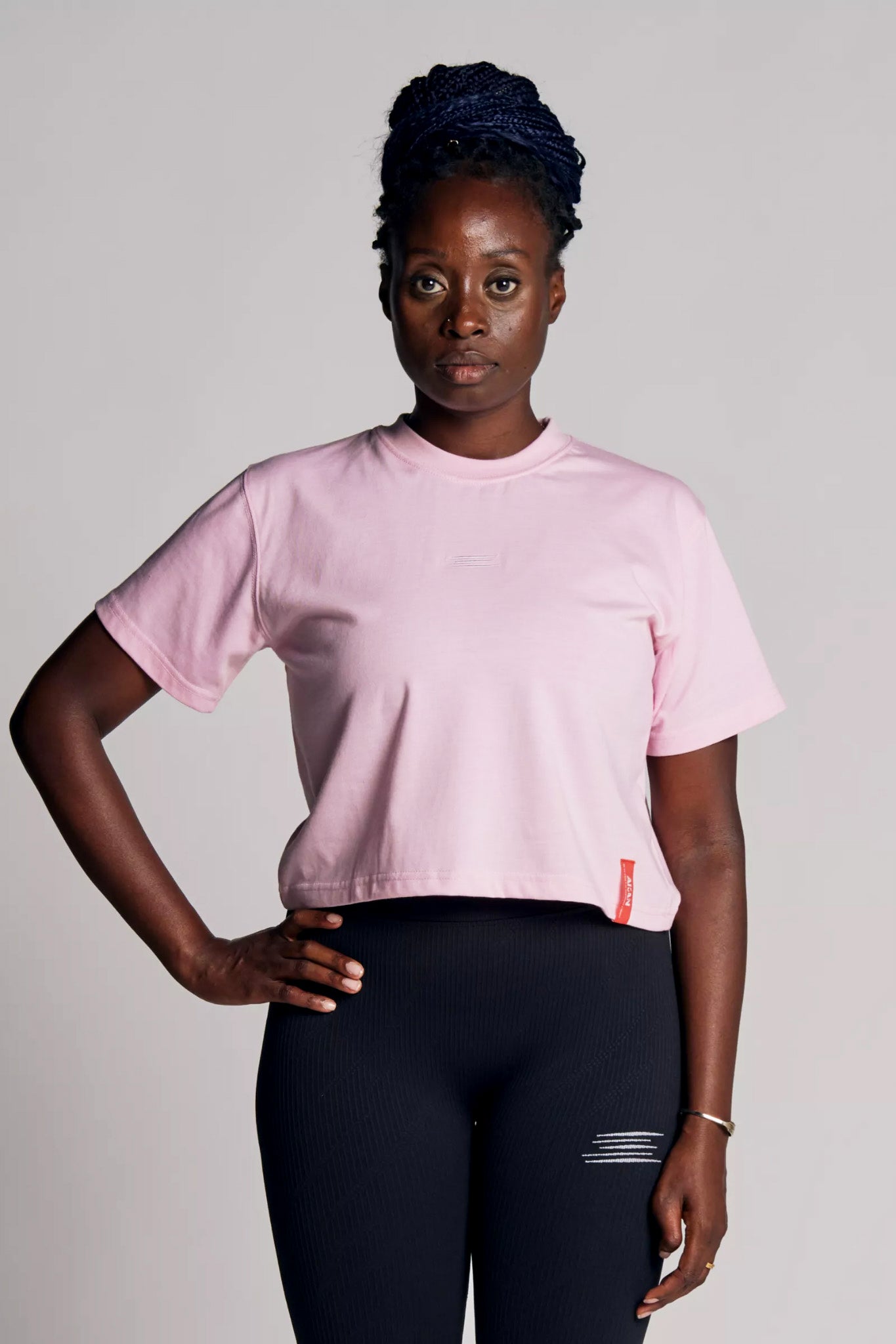 Model wearing AKAN cropped Shirt Pink from Eve Roger Athletics